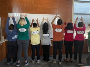 Halloween costumes featuring people dressed in colorful shirts. 
