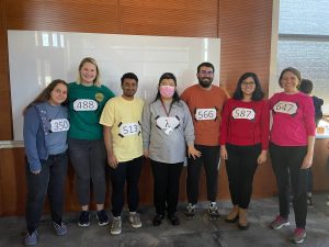 Halloween costumes featuring people wearing colorful shirts. 