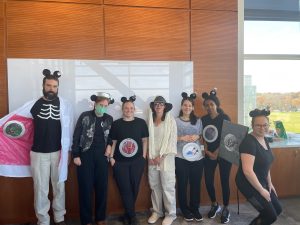 Halloween costumes featuring people dressed in mouse ears. 