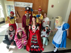 Halloween costumes featuring an Alice in Wonderland theme. 