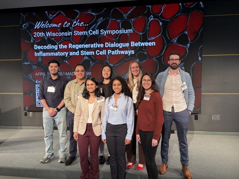 Group of students with a backdrop that says "Welcome to the 20th Wisconsin Stem Cell Symposium
Decoding the Regenerative Dialogue Between Inflammatory and Stem Cell Pathways"