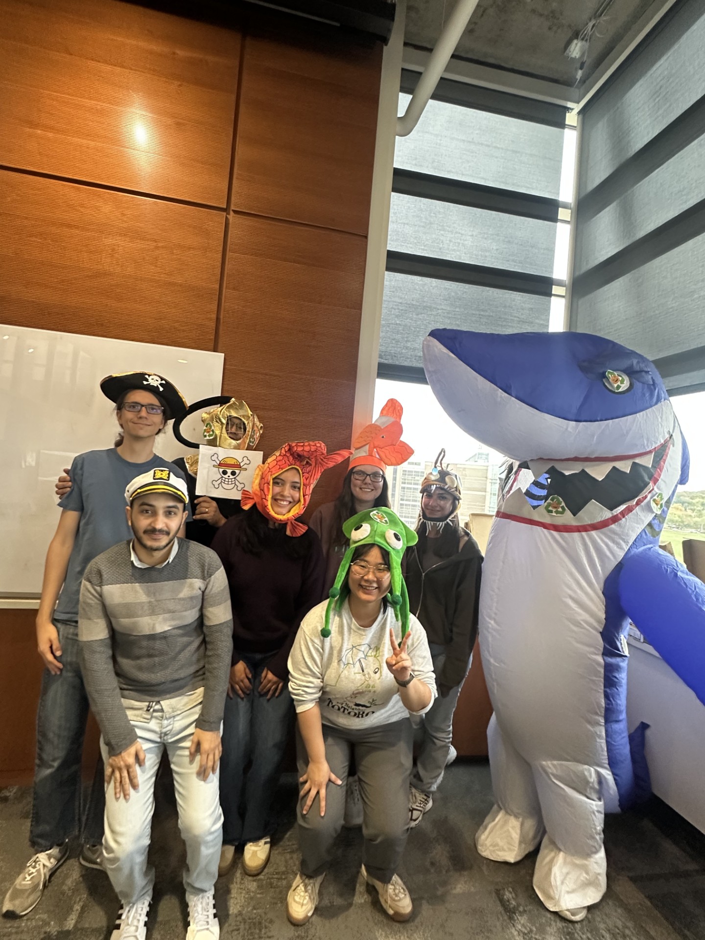 Group of people wearing pirate-and-underwater themed costumes. 